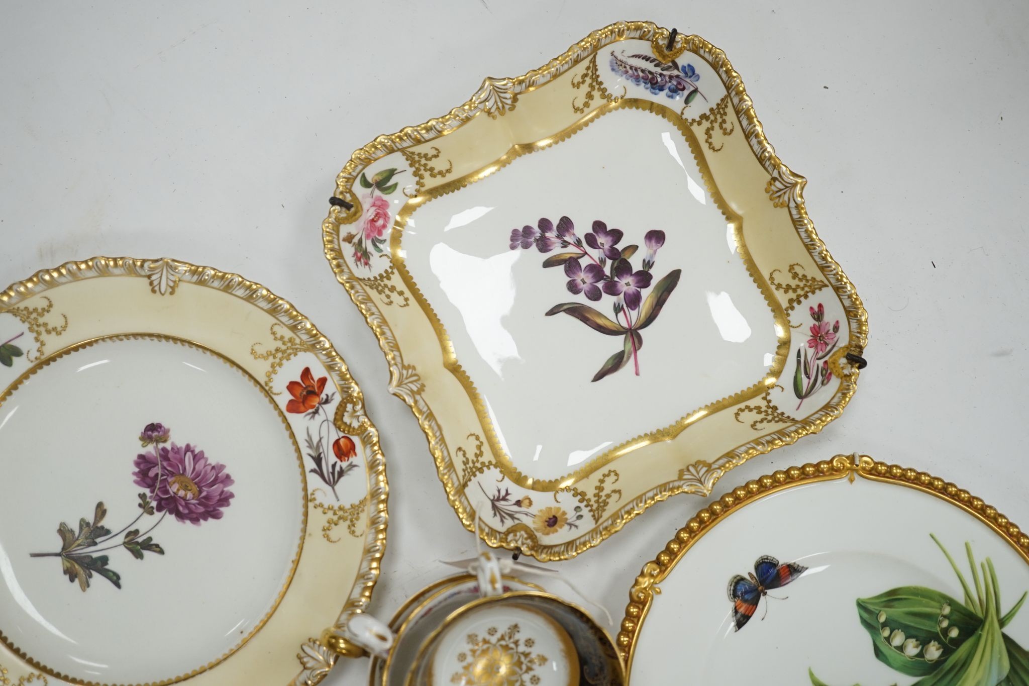 A small collection of Victorian porcelain tea cups and saucers and sundry dessert plates